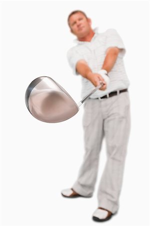 Golf club being used against a white background Stock Photo - Budget Royalty-Free & Subscription, Code: 400-06638358