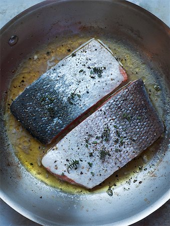 salmon skin - Fresh seasoned salmon fillets cooking in stainless saute pan Stock Photo - Budget Royalty-Free & Subscription, Code: 400-06638459