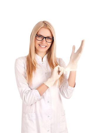 Young smiling blond doctor putting on gloves Stock Photo - Budget Royalty-Free & Subscription, Code: 400-06638787
