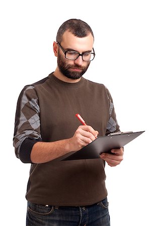 simsearch:400-06769983,k - Portrait of a young man writing on a clipboard Foto de stock - Royalty-Free Super Valor e Assinatura, Número: 400-06638810