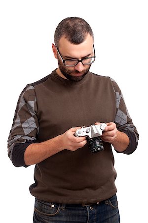 simsearch:400-06769983,k - Portrait of young man with beard holding photo camera Foto de stock - Royalty-Free Super Valor e Assinatura, Número: 400-06638812