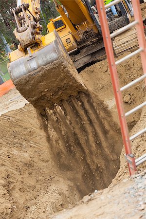 simsearch:400-05326745,k - Working Excavator Tractor Digging A Trench. Fotografie stock - Microstock e Abbonamento, Codice: 400-06639571