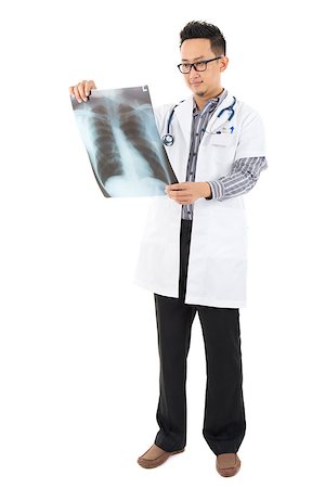 doctor checking full body - Full body Asian medical doctor checking on x-ray image standing isolated white background Stock Photo - Budget Royalty-Free & Subscription, Code: 400-06639676