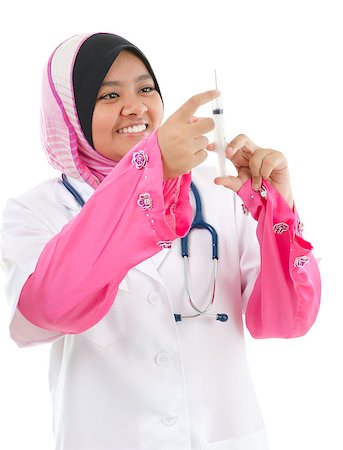Muslim female medical doctor filling the syringe getting ready for a medical procedure, isolated on white background Stock Photo - Budget Royalty-Free & Subscription, Code: 400-06639671