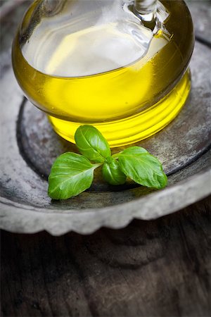 simsearch:400-05666507,k - Cooking food ingredients. Olive oil and basil leaf Stock Photo - Budget Royalty-Free & Subscription, Code: 400-06639714