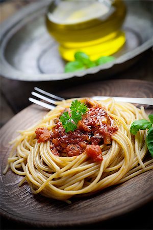 Italian food. Pasta spaghtti with tomato sauce, olives and garnish Stock Photo - Budget Royalty-Free & Subscription, Code: 400-06639716