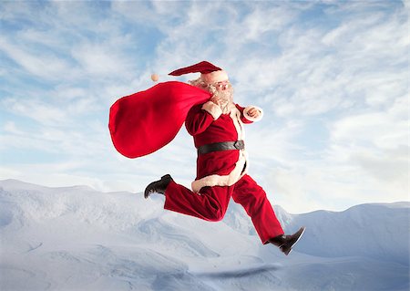 simsearch:400-06639922,k - Santa Claus running with his sack over the mountains Stock Photo - Budget Royalty-Free & Subscription, Code: 400-06639920