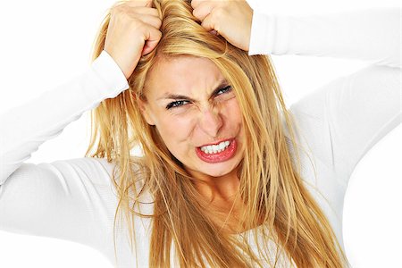 person screaming pulling hair - A picture of a young depressed woman tearing out her hair over white background Stock Photo - Budget Royalty-Free & Subscription, Code: 400-06630505