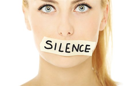 simsearch:400-06364563,k - A picture of a young woman with a tape on her mouth and a notice "silence" Stock Photo - Budget Royalty-Free & Subscription, Code: 400-06630506