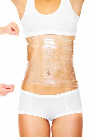 spa background - A picture of a sexy female body being wrapped around with foil to reduce fat over white background Stock Photo - Budget Royalty-Free & Subscription, Code: 400-06630520