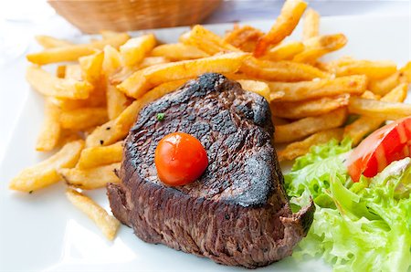 restaurant steak - juicy steak beef meat with tomato and french fries Stock Photo - Budget Royalty-Free & Subscription, Code: 400-06631251