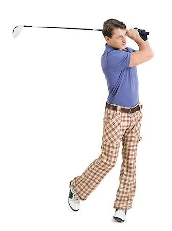 Photo of a male golfer in his late twenties finishing his swing with a driver. Stock Photo - Budget Royalty-Free & Subscription, Code: 400-06631675
