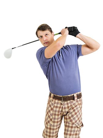 Photo of a male golfer in his late twenties finishing his swing with a driver. Stock Photo - Budget Royalty-Free & Subscription, Code: 400-06631677