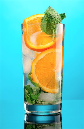 Mojito orange cocktail.on blue background. Foto de stock - Super Valor sin royalties y Suscripción, Código: 400-06631817
