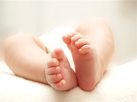 Baby feet, isolated towards white blanket and white background Foto de stock - Super Valor sin royalties y Suscripción, Código: 400-06632060