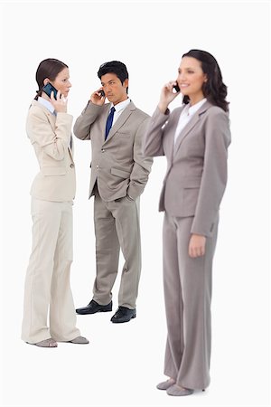 simsearch:400-06686555,k - Salespeople on their cellphones against a white background Stock Photo - Budget Royalty-Free & Subscription, Code: 400-06632110