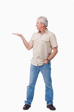 person holding up sign - Mature male looking at his palm against a white background Stock Photo - Budget Royalty-Free & Subscription, Code: 400-06632291