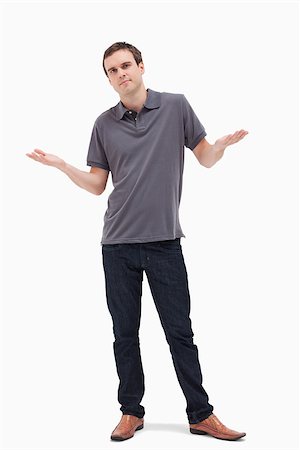 someone shrugging their shoulders - Man shrugging his shoulders against white background Stock Photo - Budget Royalty-Free & Subscription, Code: 400-06632389