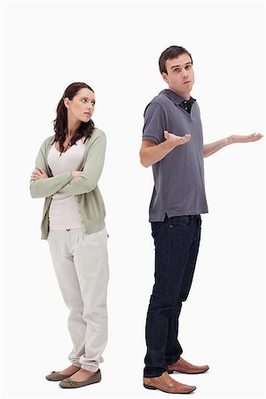 simsearch:400-08338944,k - Man shrugged his shoulders back to back with angry woman against white background Stock Photo - Budget Royalty-Free & Subscription, Code: 400-06632404