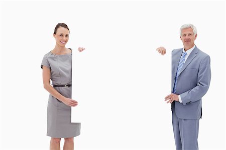 White hair businessman holding a big white sign with a woman against white background Stock Photo - Budget Royalty-Free & Subscription, Code: 400-06632554