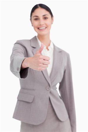 simsearch:400-05898224,k - Thumb up given by smiling businesswoman against a white background Foto de stock - Royalty-Free Super Valor e Assinatura, Número: 400-06633065