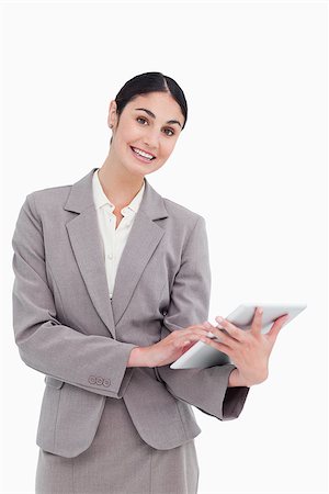 sales person with a tablet - Smiling tradeswoman with her tablet computer against a white background Stock Photo - Budget Royalty-Free & Subscription, Code: 400-06633103