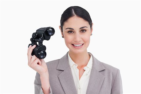 simsearch:400-04554899,k - Businesswoman with spy glasses against a white background Stock Photo - Budget Royalty-Free & Subscription, Code: 400-06633114