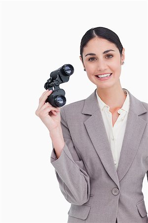 simsearch:400-04554899,k - Smiling businesswoman with spy glasses against a white background Stock Photo - Budget Royalty-Free & Subscription, Code: 400-06633115