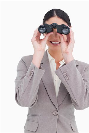 simsearch:400-04554899,k - Businesswoman looking through binoculars against a white background Stock Photo - Budget Royalty-Free & Subscription, Code: 400-06633112