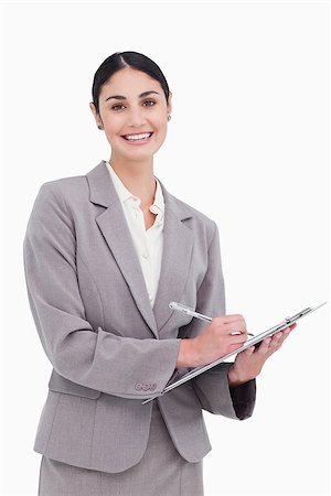 simsearch:400-06633122,k - Smiling businesswoman ready to take notes against a white background Stock Photo - Budget Royalty-Free & Subscription, Code: 400-06633120