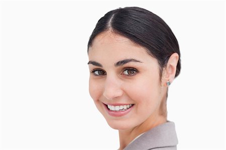 simsearch:400-06633122,k - Close up of smiling young businesswoman against a white background Stock Photo - Budget Royalty-Free & Subscription, Code: 400-06633147