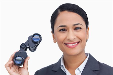 simsearch:400-06633122,k - Close up of smiling saleswoman with spy glasses against a white background Stock Photo - Budget Royalty-Free & Subscription, Code: 400-06633167