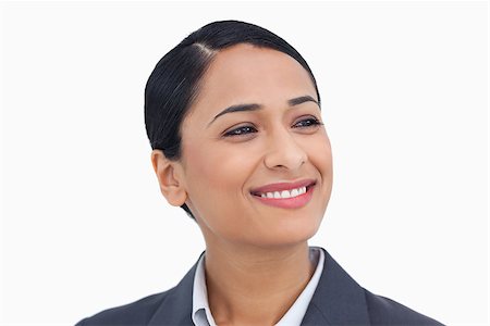 simsearch:400-06633122,k - Close up of smiling saleswoman looking to the side against a white background Stock Photo - Budget Royalty-Free & Subscription, Code: 400-06633168