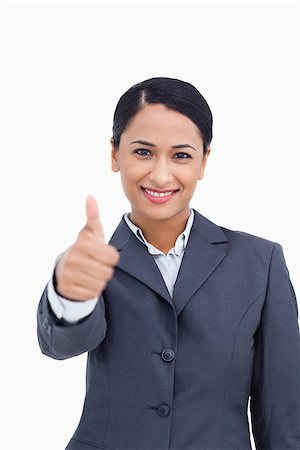 simsearch:400-05898224,k - Close up of smiling saleswoman giving thumb up against a white background Foto de stock - Royalty-Free Super Valor e Assinatura, Número: 400-06633176