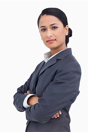 simsearch:400-06633122,k - Close up of serious saleswoman with arms folded against a white background Stock Photo - Budget Royalty-Free & Subscription, Code: 400-06633172
