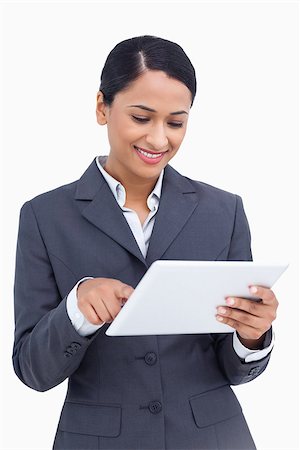 sales person with a tablet - Close up of smiling saleswoman using her tablet computer against a white background Stock Photo - Budget Royalty-Free & Subscription, Code: 400-06633206
