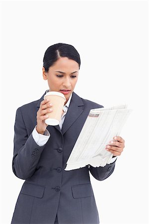 Close up of saleswoman with paper cup and news paper against a white background Photographie de stock - Aubaine LD & Abonnement, Code: 400-06633214