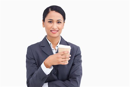 simsearch:400-06633122,k - Close up of smiling saleswoman with paper cup against a white background Stock Photo - Budget Royalty-Free & Subscription, Code: 400-06633217