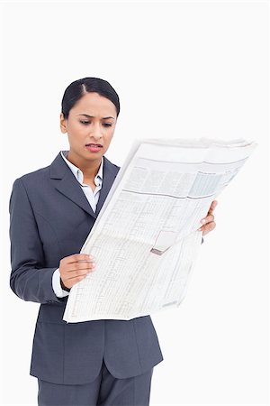 simsearch:632-01157433,k - Close up of saleswoman reading the news against a white background Stock Photo - Budget Royalty-Free & Subscription, Code: 400-06633213