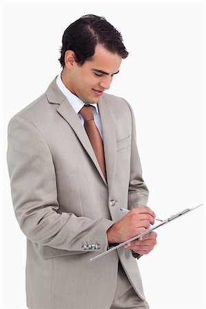 simsearch:400-06633122,k - Salesman taking notes against a white background Stock Photo - Budget Royalty-Free & Subscription, Code: 400-06633374