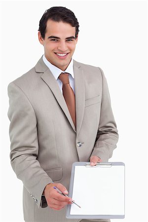 simsearch:400-06633122,k - Smiling salesman asking for signature against a white background Stock Photo - Budget Royalty-Free & Subscription, Code: 400-06633376