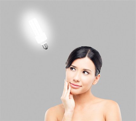 Beautiful Asian woman thinking with  a light over her head Stock Photo - Budget Royalty-Free & Subscription, Code: 400-06633425