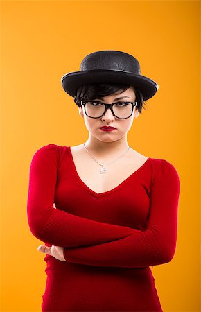 funny looking girls with glasses - Portrait of a beautiful girl bored with something, wearing a hat and nerd glasses Stock Photo - Budget Royalty-Free & Subscription, Code: 400-06633448