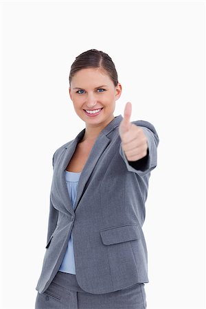 simsearch:400-05898224,k - Smiling saleswoman giving her approval against a white background Foto de stock - Royalty-Free Super Valor e Assinatura, Número: 400-06633942