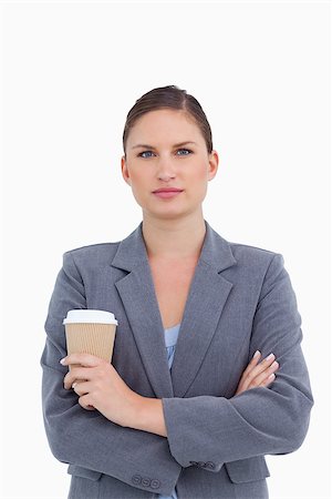 simsearch:400-06633122,k - Tradeswoman with arms folded and paper cup against a white background Stock Photo - Budget Royalty-Free & Subscription, Code: 400-06633998