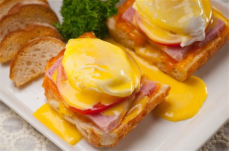 simsearch:400-07510513,k - fresh eggs benedict on bread with tomato and ham Stock Photo - Budget Royalty-Free & Subscription, Code: 400-06644217