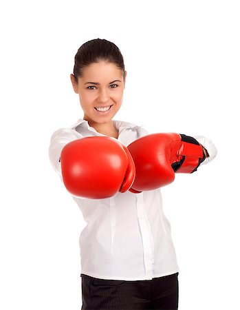 portrait of woman wearing boxing gloves - Portrait of business woman wearing boxing gloves. Focus on gloves Stock Photo - Budget Royalty-Free & Subscription, Code: 400-06644295