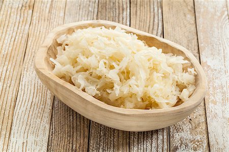simsearch:400-08342479,k - sauerkraut in a rustic wooden bowl against white painted wooden background Stock Photo - Budget Royalty-Free & Subscription, Code: 400-06644502