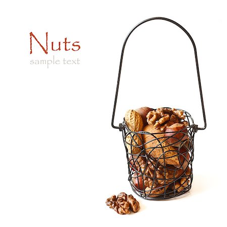simsearch:400-04180817,k - Mix of nuts in a basket on a white background. Photographie de stock - Aubaine LD & Abonnement, Code: 400-06640332