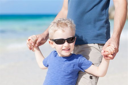 handsome little boy with his father at the tropical beach Stock Photo - Budget Royalty-Free & Subscription, Code: 400-06640409